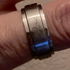 Size 9 titanium fidget ring with carved dragon detail around outside ring